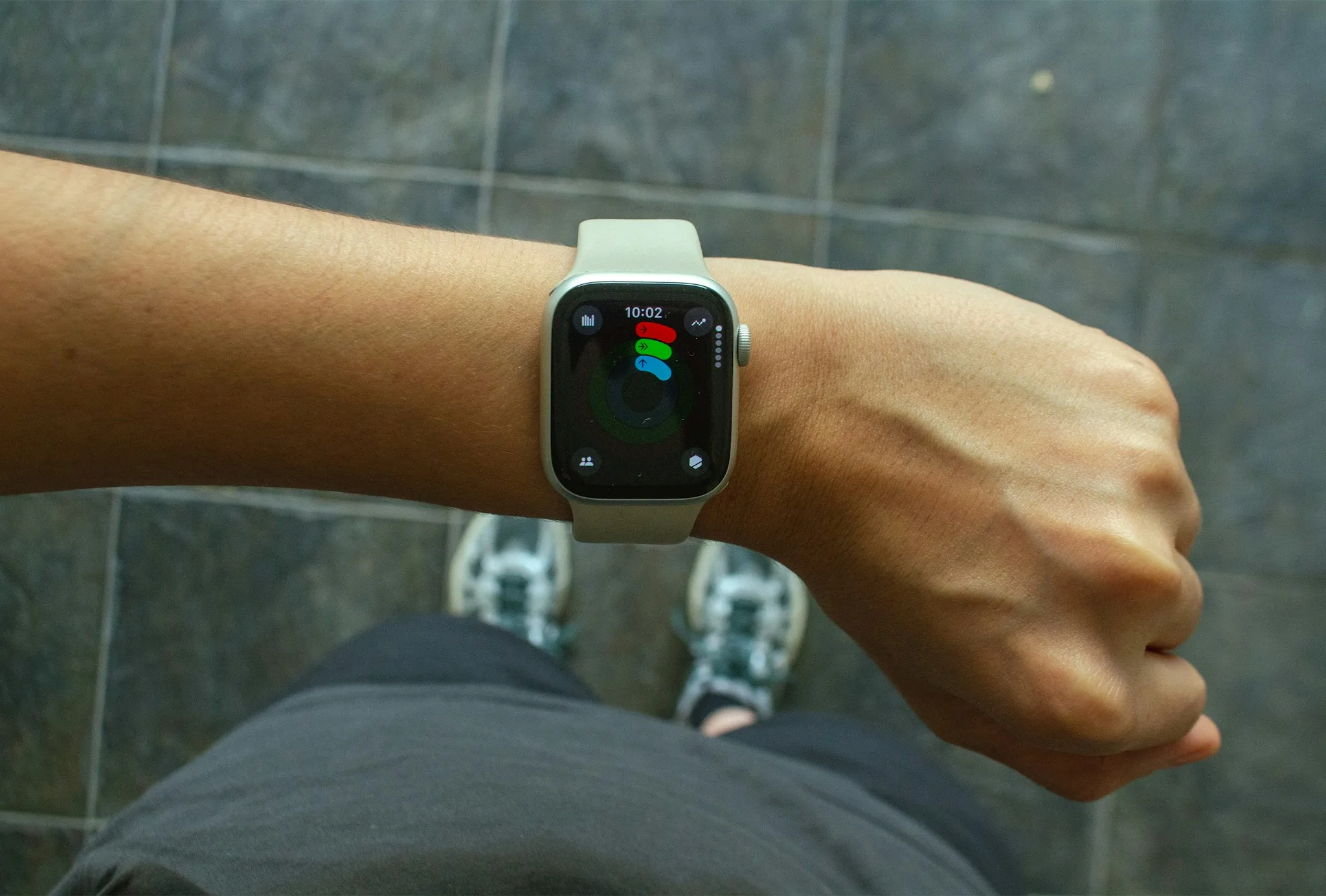 Apple Watch on a wrist with health stats on screen