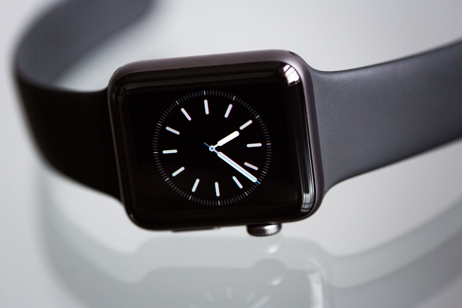 Black Apple Watch with sports band on a light background