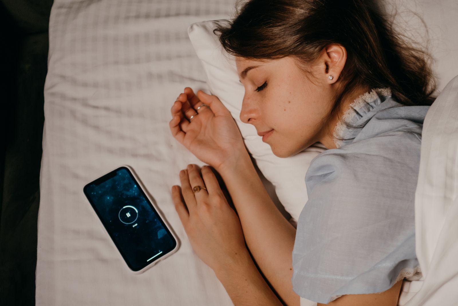 Woman asleep in bed at night